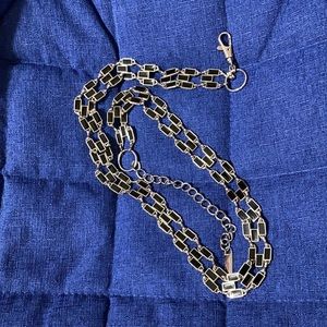 This black and silver belt.